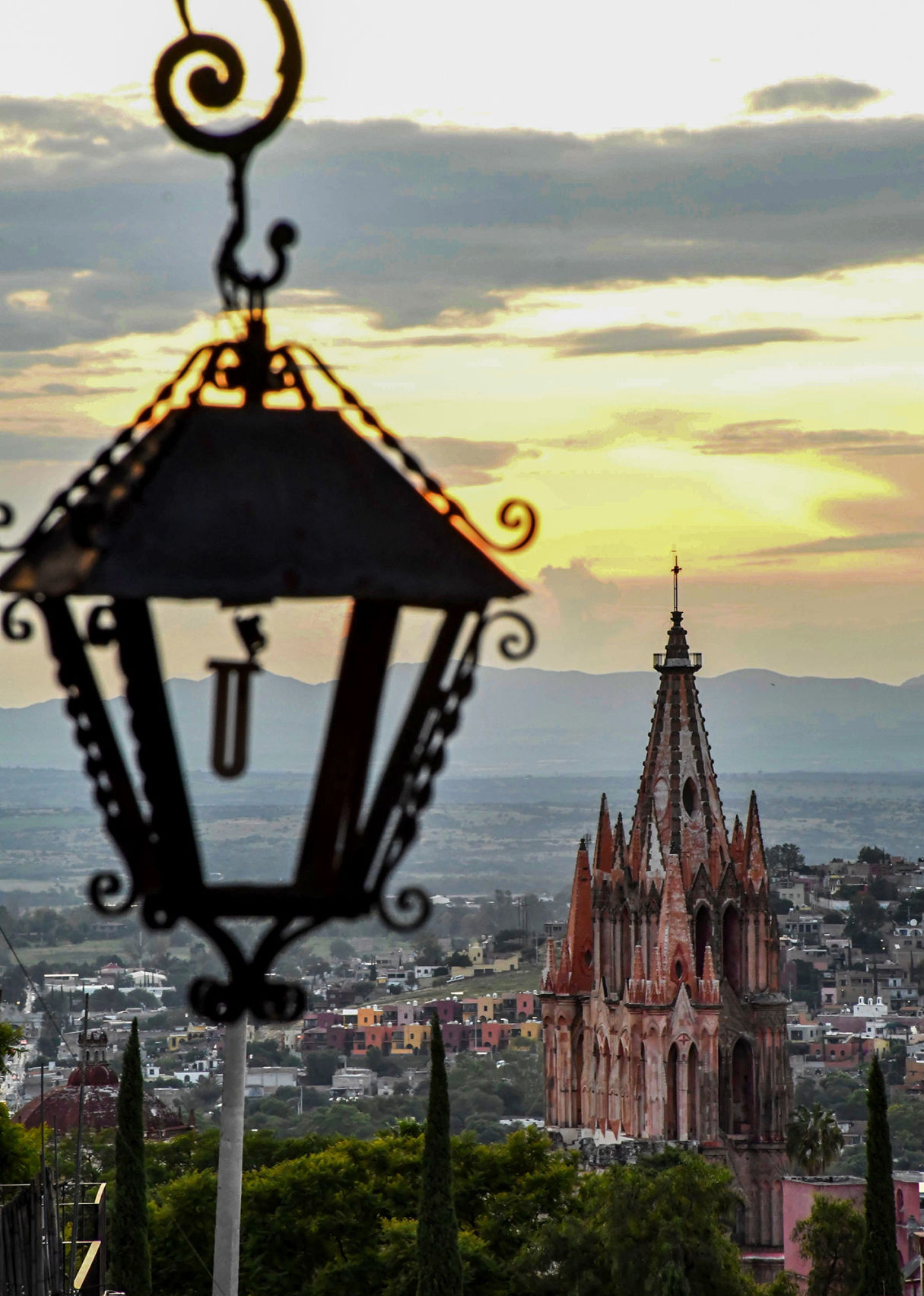 I searched for something to put in the foreground of La Parroquia. When I saw the details on this lantern, I tried every possible depth of field, unsure which worked best. My photo editors were sure. The church is more consequential, so they chose this shot.